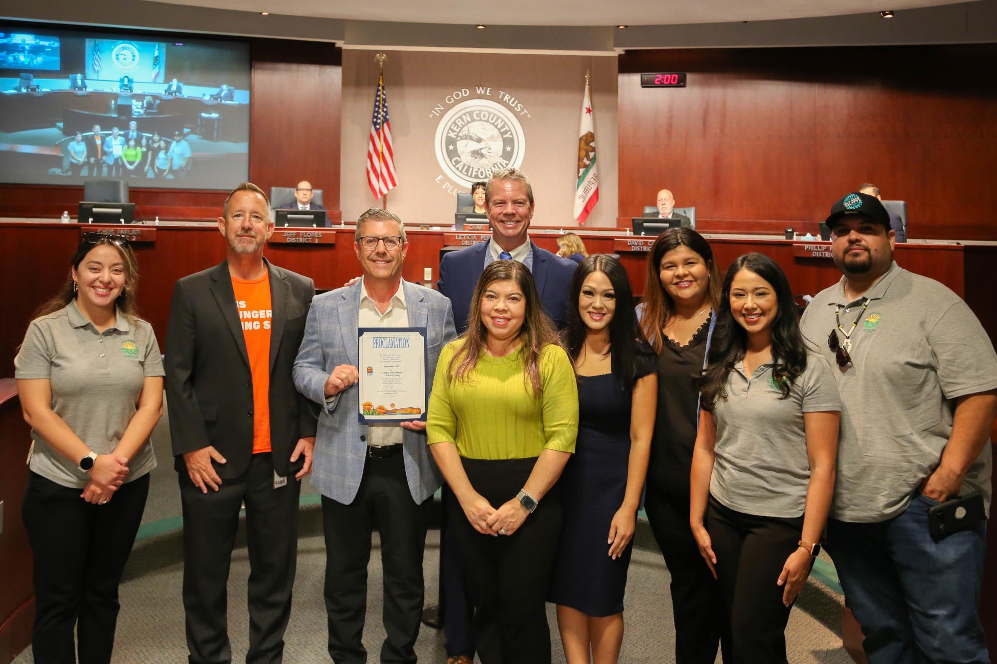 Community Action Partnership of Kern receiving a board proclamation for Fight Huger Month