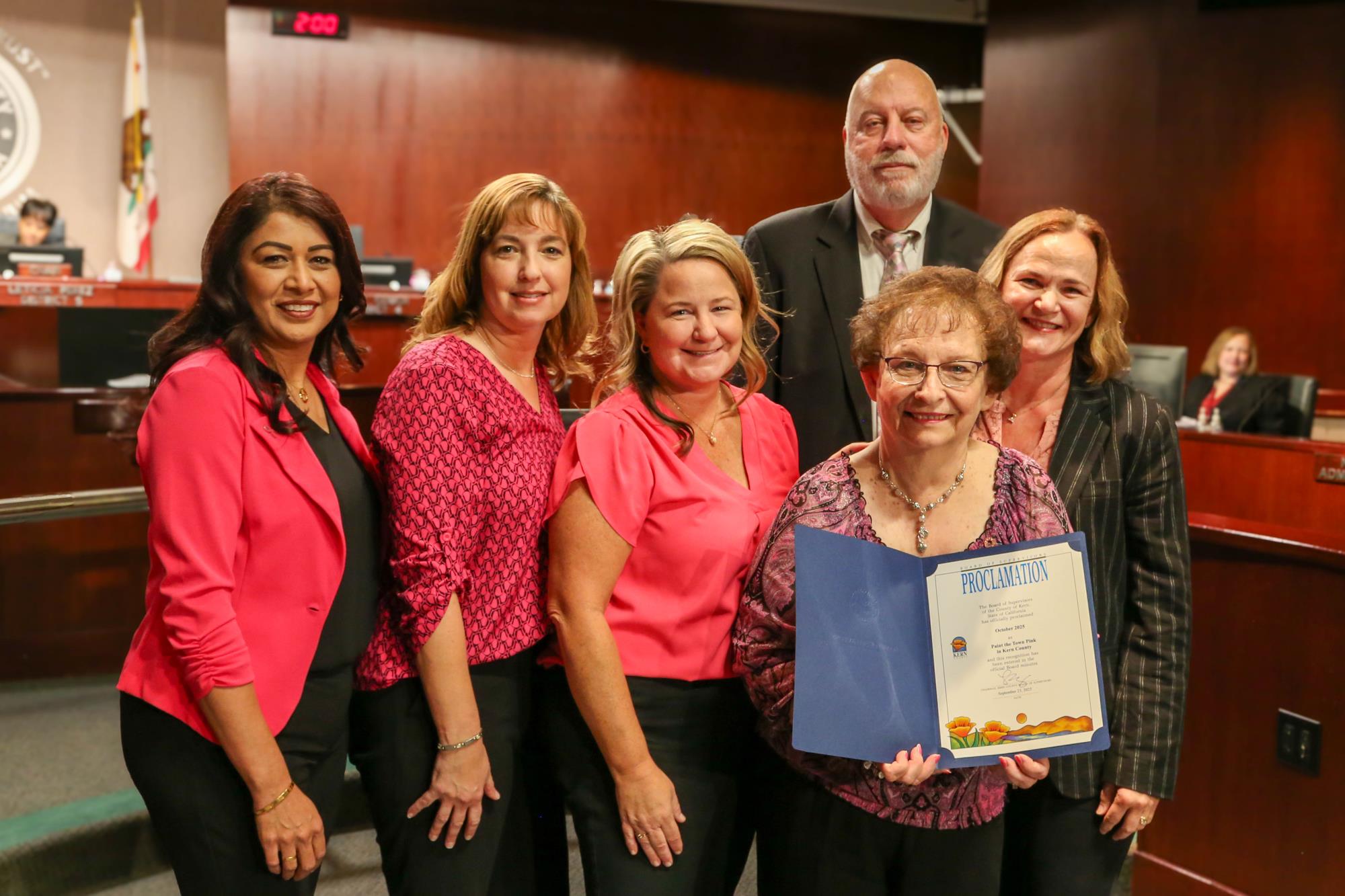 Supervisor David Couch presenting a Board Proclamation to Links for Life representatives declaring October Paint the Town Pink Month in Kern County